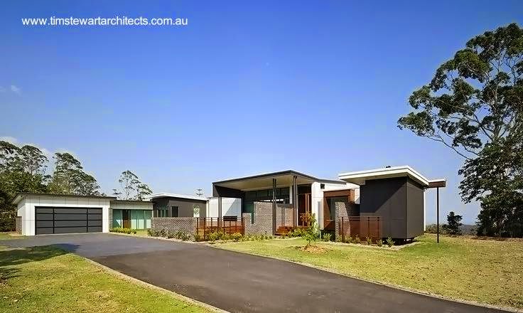 Vista desde el acceso por automóvil al frente Fachadas a la calle del proyecto Mountainview en Australia una casa de campo moderna